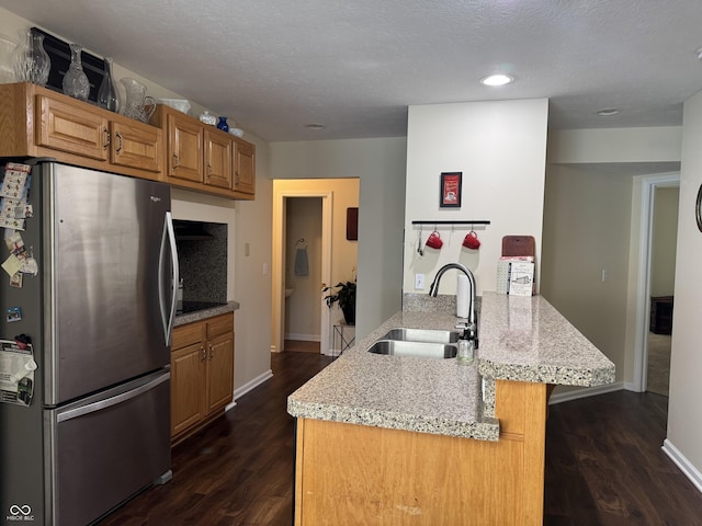 1626 N Nieman Dr, Greensburg, IN 47240 - kitchen with freestanding refrigerator, a peninsula, dark wood-style floors, recessed lighting, and light stone counters