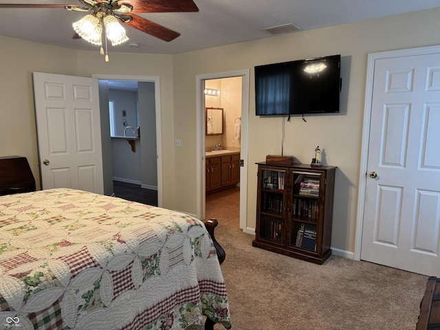1626 N Nieman Dr, Greensburg, IN 47240 - carpeted bedroom with connected bathroom and a ceiling fan