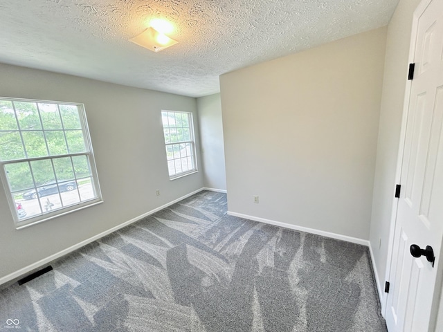 6839 Antelope Dr, Indianapolis, IN 46278 - spare room with carpet and a textured ceiling