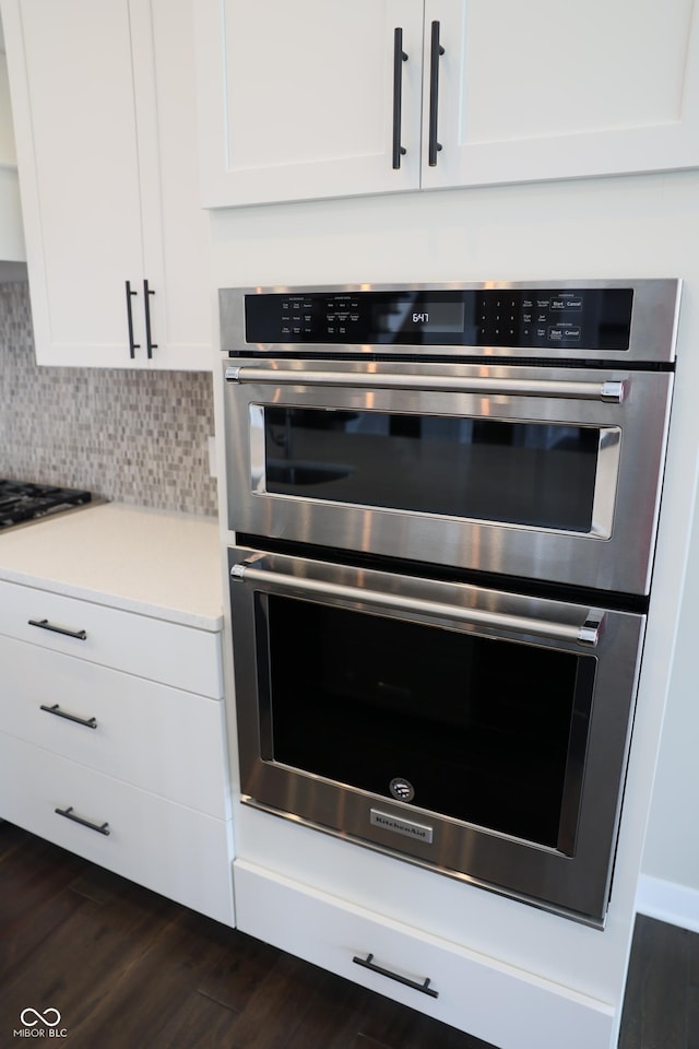 13044 Moorland Ln, Carmel, IN 46074 - kitchen featuring appliances with stainless steel finishes, white cabinetry, and dark wood-type flooring