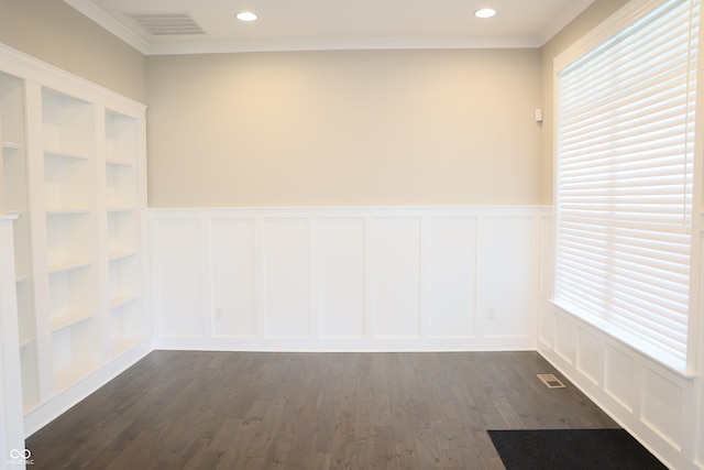 13044 Moorland Ln, Carmel, IN 46074 - unfurnished room with a decorative wall, plenty of natural light, a wainscoted wall, ornamental molding, and dark wood-style floors