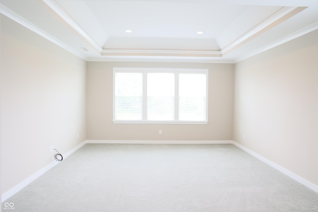 13044 Moorland Ln, Carmel, IN 46074 - spare room with a tray ceiling, light carpet, crown molding, and recessed lighting