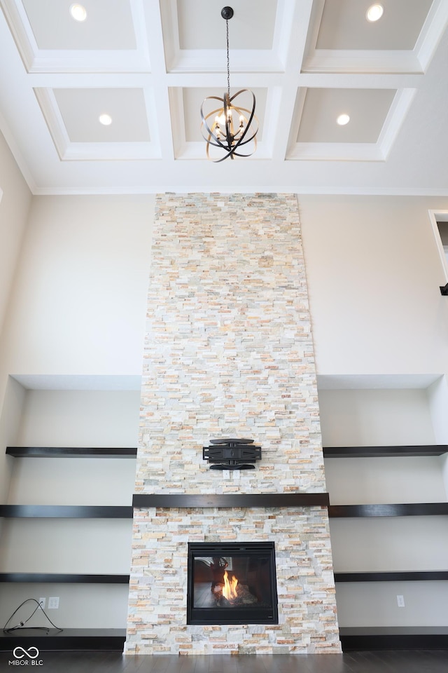 13044 Moorland Ln, Carmel, IN 46074 - detailed view of coffered ceiling, a chandelier, crown molding, beamed ceiling, and a fireplace