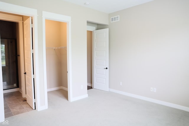 13044 Moorland Ln, Carmel, IN 46074 - unfurnished bedroom with carpet flooring and a walk in closet