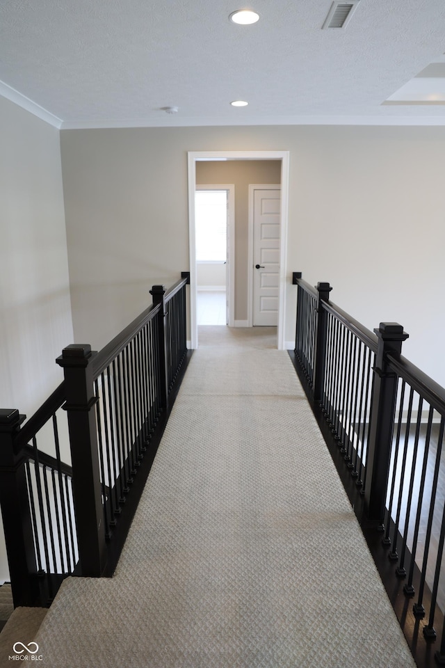 13044 Moorland Ln, Carmel, IN 46074 - hallway featuring an upstairs landing, carpet, ornamental molding, and recessed lighting