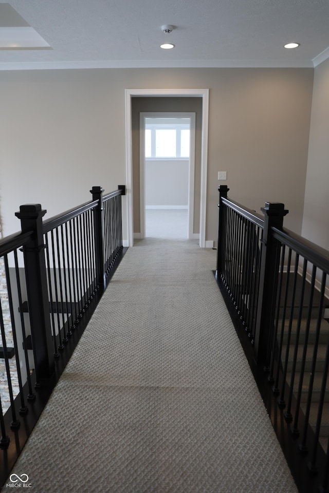 13044 Moorland Ln, Carmel, IN 46074 - corridor with an upstairs landing, ornamental molding, carpet floors, and recessed lighting