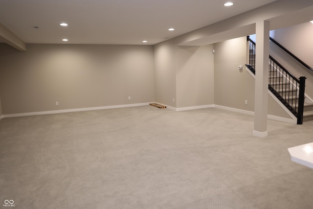 13044 Moorland Ln, Carmel, IN 46074 - finished below grade area with recessed lighting, light colored carpet, and stairway