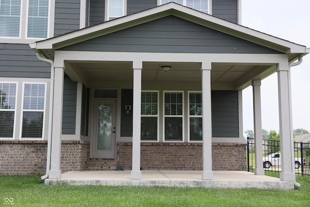 13044 Moorland Ln, Carmel, IN 46074 - property entrance featuring brick siding and covered porch