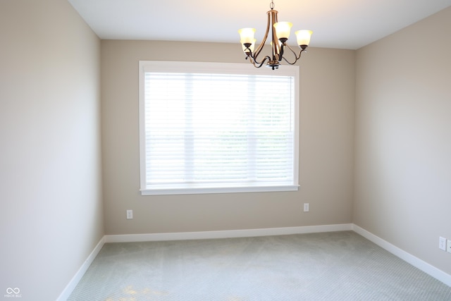 13044 Moorland Ln, Carmel, IN 46074 - unfurnished room featuring light colored carpet and a chandelier