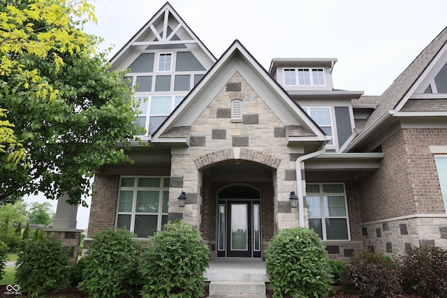 13044 Moorland Ln, Carmel, IN 46074 - view of exterior entry featuring stone siding and brick siding