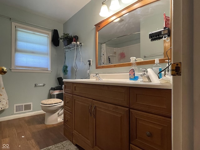 7725 S Oak Dr, Indianapolis, IN 46227 - full bathroom with wood finished floors, vanity, and a shower with curtain