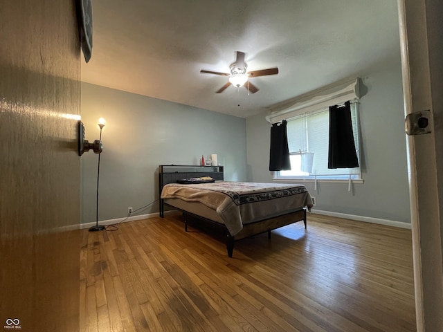 7725 S Oak Dr, Indianapolis, IN 46227 - bedroom featuring hardwood / wood-style flooring and a ceiling fan
