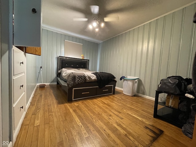 7725 S Oak Dr, Indianapolis, IN 46227 - bedroom with crown molding, hardwood / wood-style floors, and ceiling fan