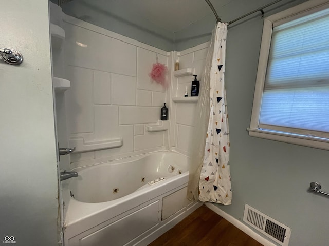 7725 S Oak Dr, Indianapolis, IN 46227 - full bath with wood finished floors and a combined bath / shower with jetted tub