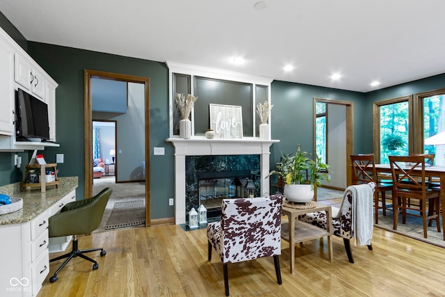 12214 Ridgeside Rd, Indianapolis, IN 46256 - dining space featuring light wood-style floors, a high end fireplace, and recessed lighting