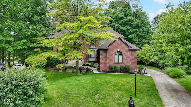 12214 Ridgeside Rd, Indianapolis, IN 46256 - view of front of home featuring a front lawn and brick siding