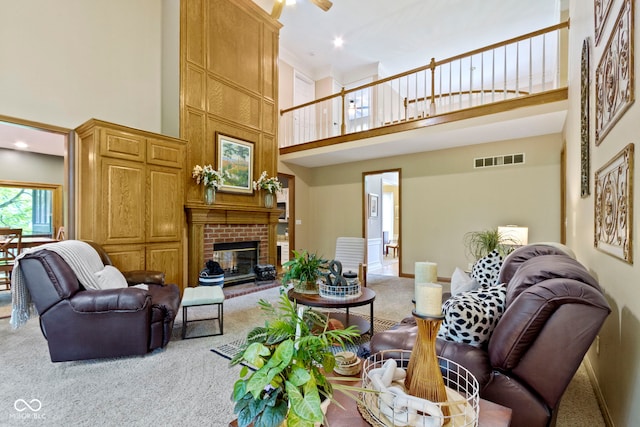 12214 Ridgeside Rd, Indianapolis, IN 46256 - living area featuring a towering ceiling, carpet, and a brick fireplace