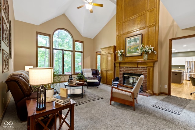 12214 Ridgeside Rd, Indianapolis, IN 46256 - living room with high vaulted ceiling, a ceiling fan, light carpet, a brick fireplace, and recessed lighting