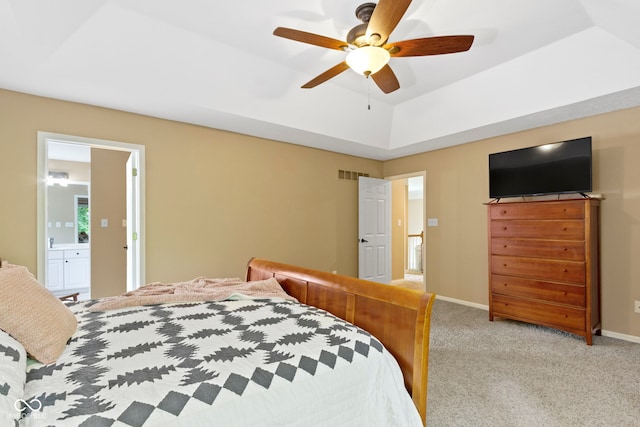12214 Ridgeside Rd, Indianapolis, IN 46256 - bedroom featuring light carpet, ceiling fan, ensuite bathroom, and a tray ceiling