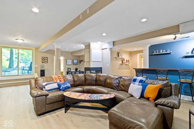 12214 Ridgeside Rd, Indianapolis, IN 46256 - living area featuring decorative columns, bar area, light wood finished floors, and recessed lighting