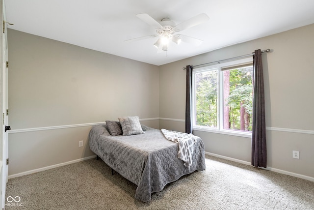 12214 Ridgeside Rd, Indianapolis, IN 46256 - carpeted bedroom with baseboards and a ceiling fan