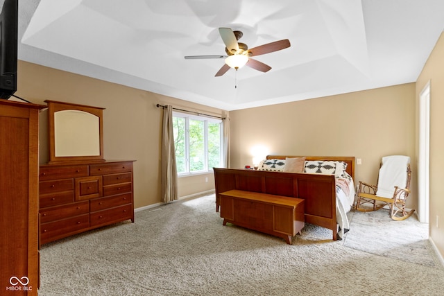 12214 Ridgeside Rd, Indianapolis, IN 46256 - bedroom featuring a tray ceiling, carpet floors, and a ceiling fan