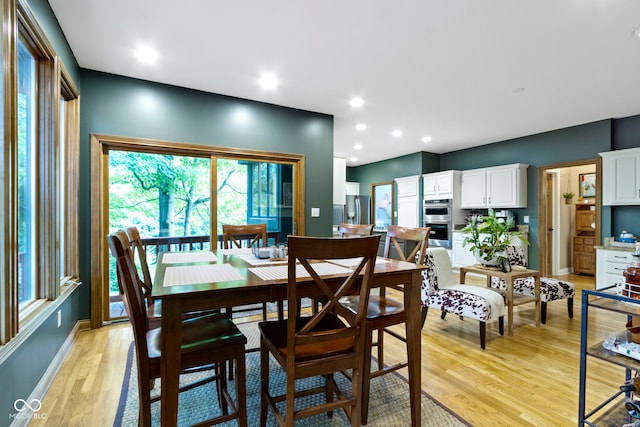 12214 Ridgeside Rd, Indianapolis, IN 46256 - dining space featuring light wood-style flooring and recessed lighting