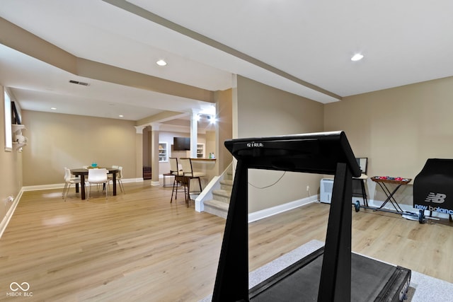 12214 Ridgeside Rd, Indianapolis, IN 46256 - exercise area featuring wood finished floors, recessed lighting, and decorative columns
