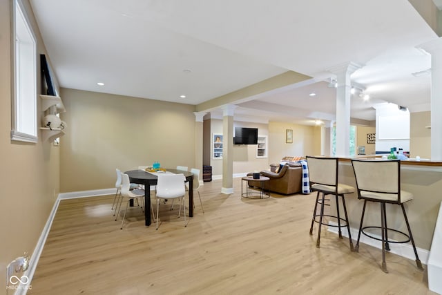 12214 Ridgeside Rd, Indianapolis, IN 46256 - dining area with ornate columns, light wood finished floors, and recessed lighting
