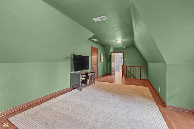 2421 W 39th St, Indianapolis, IN 46228 - bonus room featuring lofted ceiling and wood finished floors