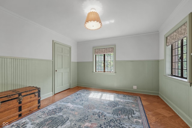 2421 W 39th St, Indianapolis, IN 46228 - unfurnished bedroom featuring a wainscoted wall and crown molding