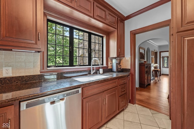2421 W 39th St, Indianapolis, IN 46228 - kitchen featuring dishwasher, arched walkways, decorative backsplash, light tile patterned floors, and ornamental molding