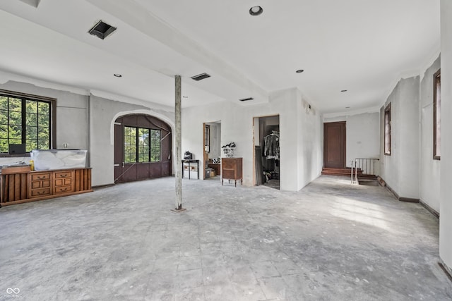 2421 W 39th St, Indianapolis, IN 46228 - unfurnished living room with arched walkways and radiator