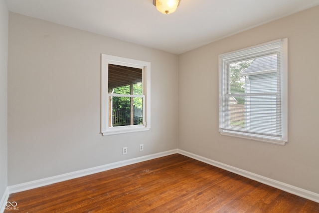 4517 E 16th St, Indianapolis, IN 46201 - unfurnished room with baseboards and dark wood-type flooring