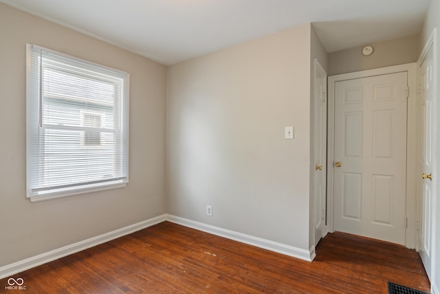 4517 E 16th St, Indianapolis, IN 46201 - spare room featuring dark wood finished floors and a smoke detector