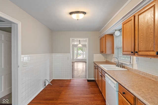 4517 E 16th St, Indianapolis, IN 46201 - kitchen featuring white dishwasher, light countertops, dark wood-style flooring, tile walls, and brown cabinets
