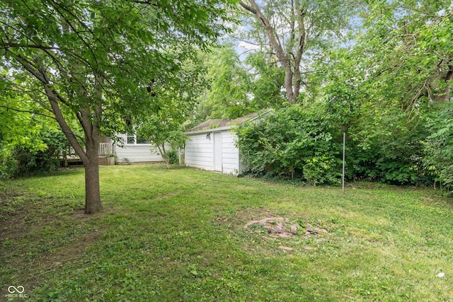 4517 E 16th St, Indianapolis, IN 46201 - view of green lawn with an outdoor structure