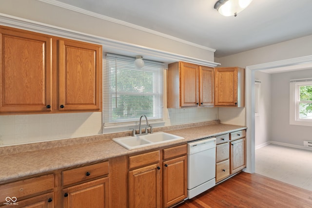 4517 E 16th St, Indianapolis, IN 46201 - kitchen featuring white dishwasher, tasteful backsplash, light countertops, and brown cabinetry