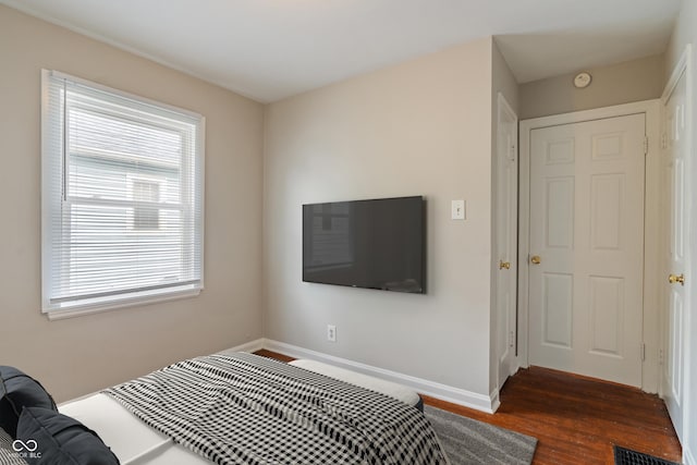 4517 E 16th St, Indianapolis, IN 46201 - bedroom featuring dark wood-style flooring and baseboards