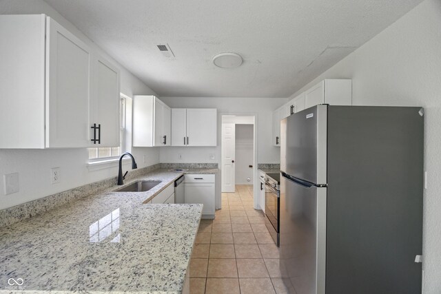 10222 Arapahoe Dr, Indianapolis, IN 46235 - kitchen with appliances with stainless steel finishes, white cabinets, light stone countertops, and light tile patterned flooring