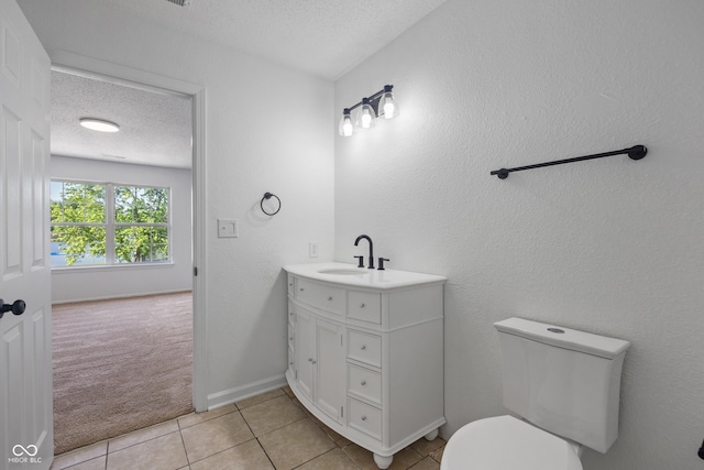 10222 Arapahoe Dr, Indianapolis, IN 46235 - bathroom with a textured ceiling, vanity, and tile patterned floors