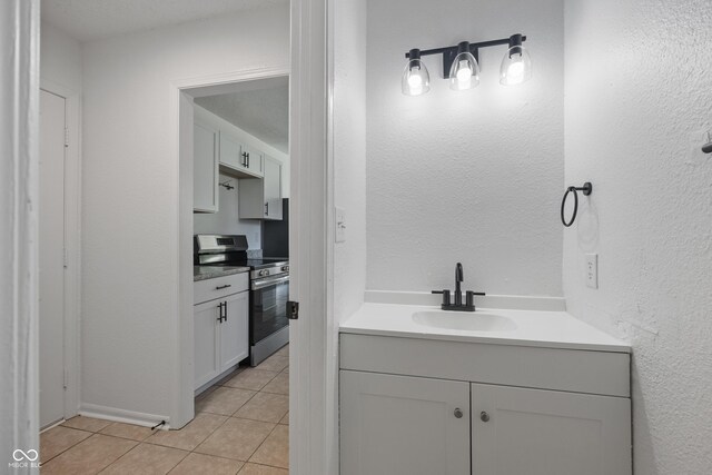 10222 Arapahoe Dr, Indianapolis, IN 46235 - bathroom with vanity and tile patterned floors