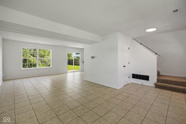 10222 Arapahoe Dr, Indianapolis, IN 46235 - unfurnished living room featuring stairs and light tile patterned flooring