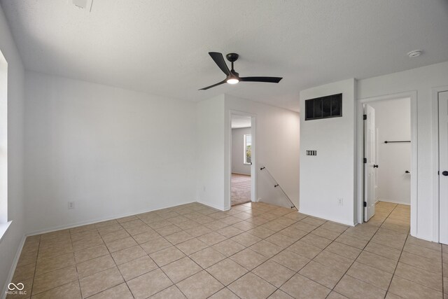 10222 Arapahoe Dr, Indianapolis, IN 46235 - unfurnished room featuring a ceiling fan, light tile patterned floors, a smoke detector, and a textured ceiling