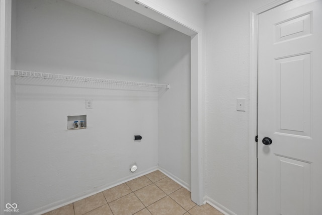 10222 Arapahoe Dr, Indianapolis, IN 46235 - washroom featuring light tile patterned floors, hookup for an electric dryer, and washer hookup