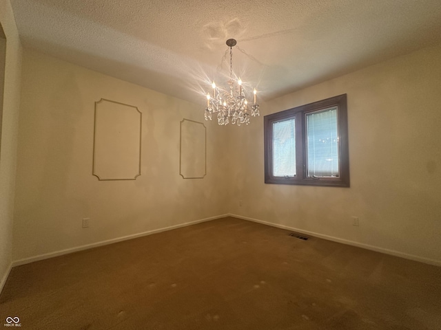 1289 Woodcreek Dr, Greenwood, IN 46142 - unfurnished room with a chandelier, dark colored carpet, and a textured ceiling