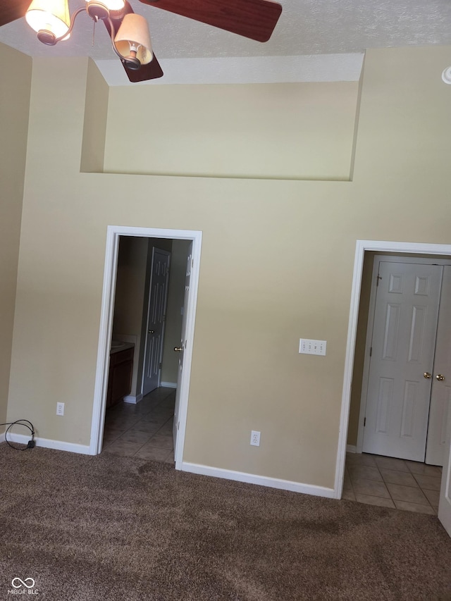 7440 Oakview Dr, Avon, IN 46123 - unfurnished room featuring carpet, tile patterned floors, and a chandelier