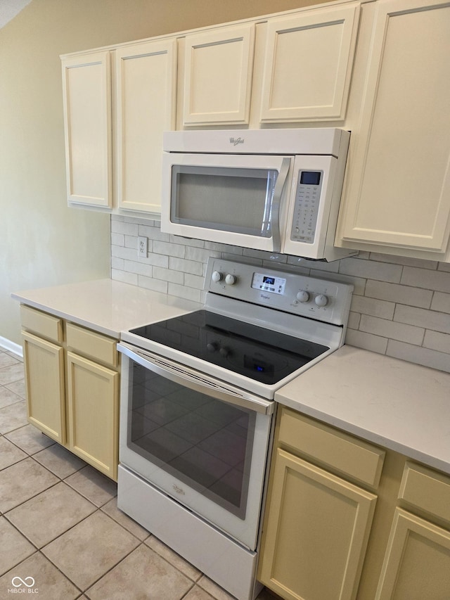 7440 Oakview Dr, Avon, IN 46123 - kitchen with white appliances, decorative backsplash, light countertops, and light tile patterned flooring