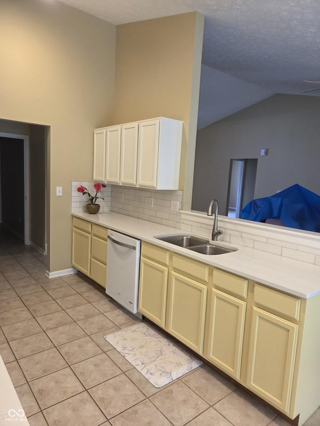 7440 Oakview Dr, Avon, IN 46123 - kitchen featuring dishwasher, lofted ceiling, light tile patterned flooring, decorative backsplash, and a peninsula