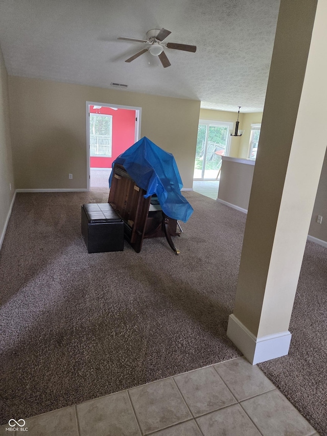 7440 Oakview Dr, Avon, IN 46123 - living area featuring carpet floors, a ceiling fan, and a textured ceiling